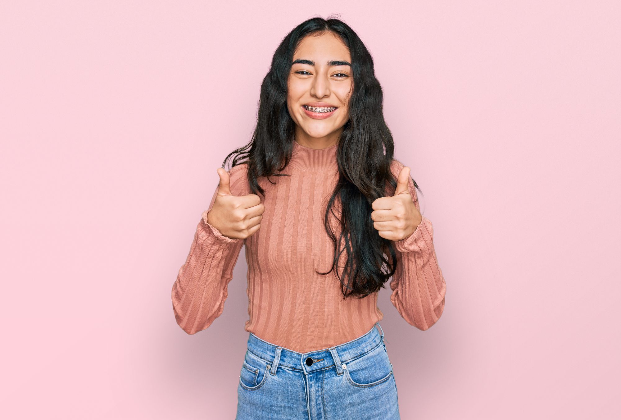 teenage girl with braces smiling