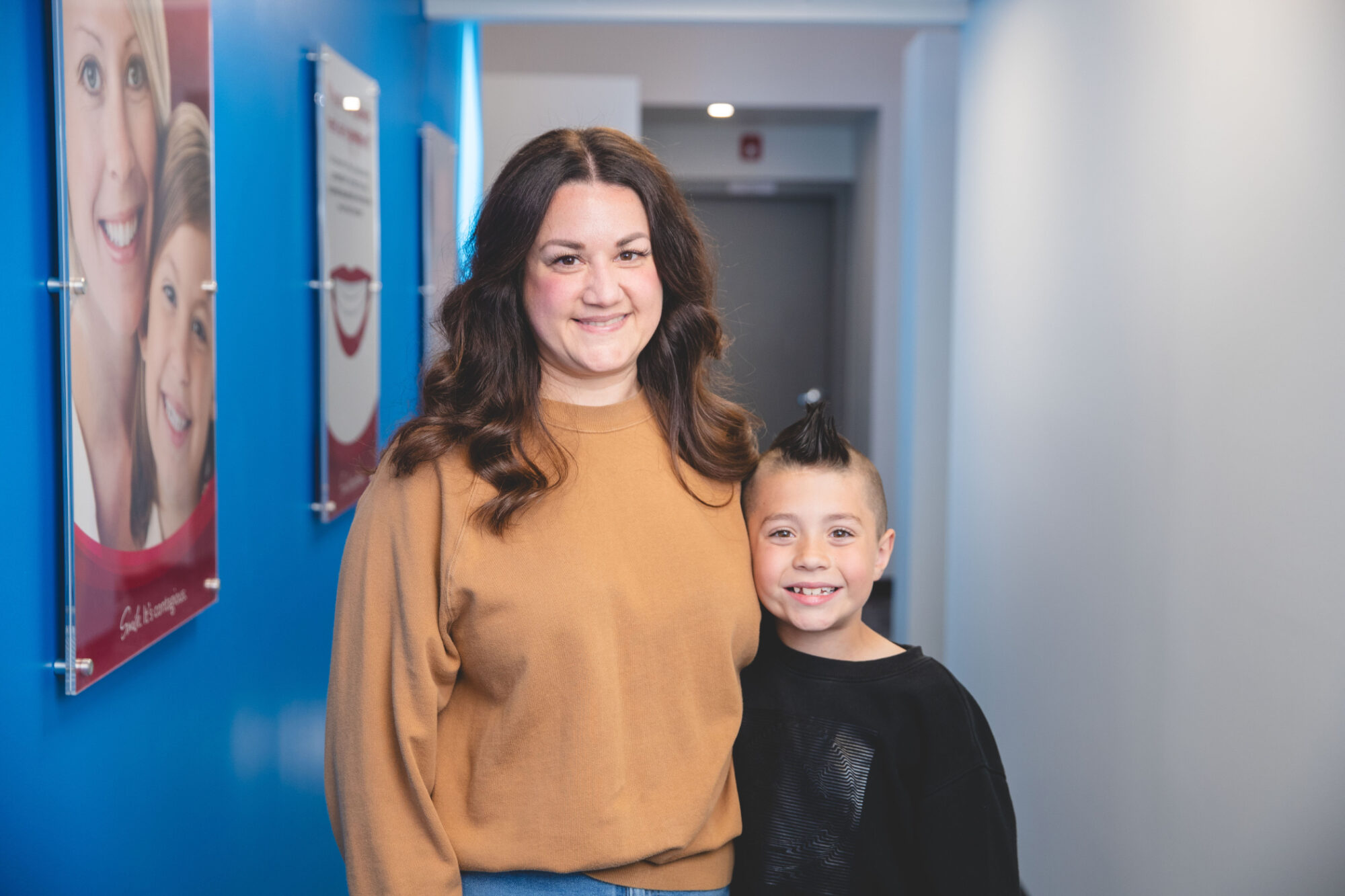 Mother and son smiling together at their Omaha orthodontist, Chartrand Orthodontics