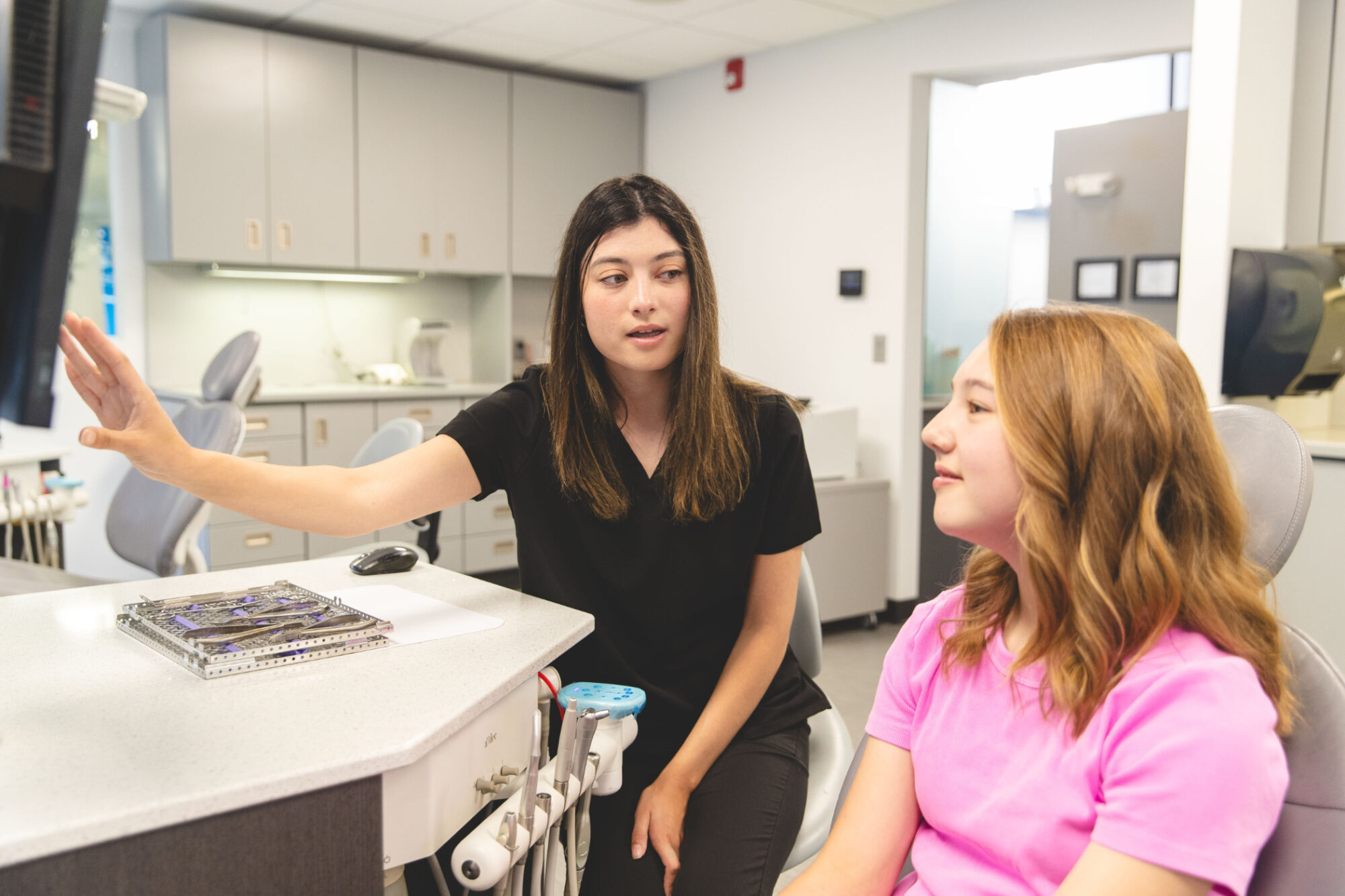 Orthodontic team member consulting with a patient at an Omaha, NE orthodontist office